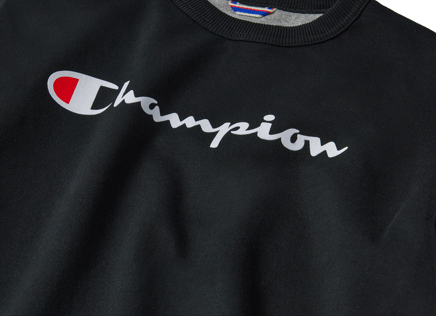 Black sweatshirt with Champion logo on a white background