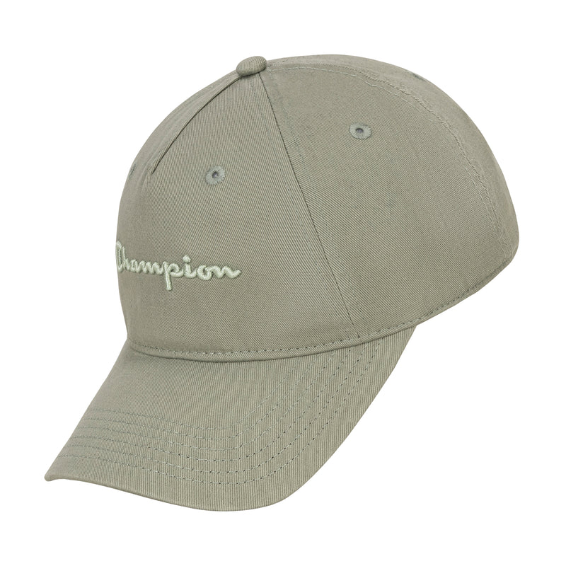 The Champion Script Embroidery Adjustable Cap is a light olive green washed cotton twill hat with a curved brim, white Champion script embroidery on the front, ventilation eyelets, a fabric-covered top button, and an adjustable strap.