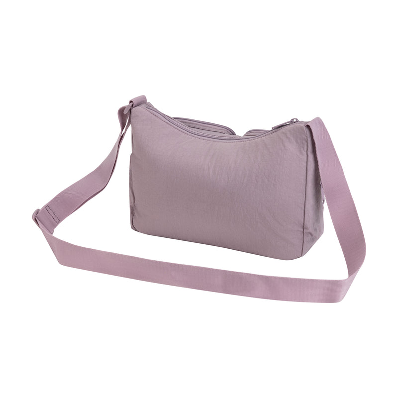 The Champion Quartz Small Messenger Bag in light purple features a long adjustable strap and zippered top for hands-free convenience, shown on a white background.