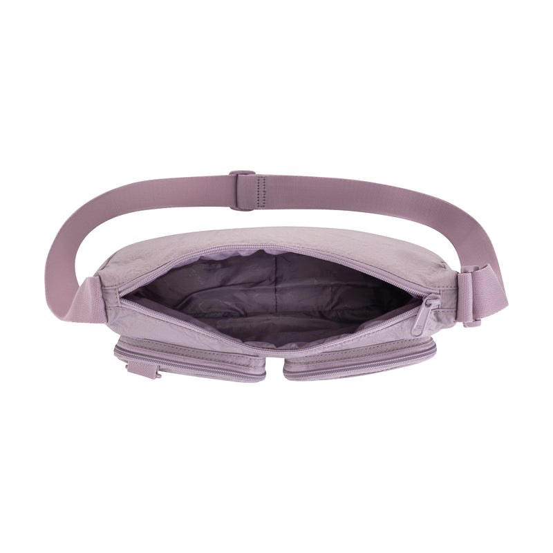 A top view of the Champion Quartz Small Messenger Bag in light purple, open to reveal its empty quilted interior and adjustable strap for hands-free convenience, set against a white background.