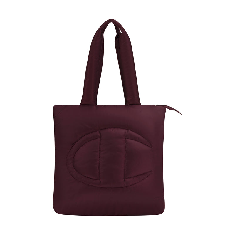 The Champion Quilted Billie Tote features a maroon quilted design, two padded handles, and a bold stitched C logo on the front—perfect for everyday use and shown against a white background.