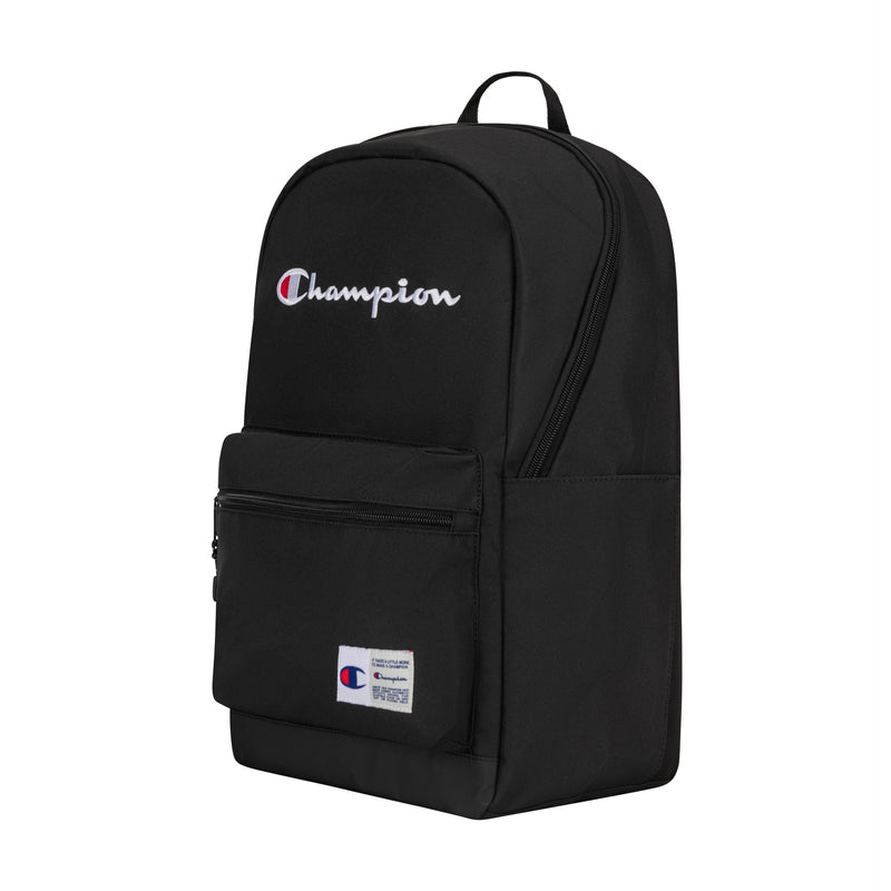 The Champion System Backpack is black with a front zip pocket, small logo patch, and a white-and-red Champion logo on top. It offers multiple compartments and a padded laptop sleeve. Set against a plain white background.