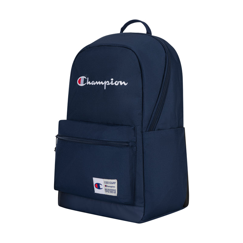 The Champion System Backpack in navy features multiple compartments, a front zippered pocket, side pocket, padded laptop sleeve, and an embroidered white and red Champion logo on the front.