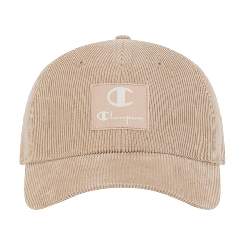 The Champion Ridge Corduroy Adjustable Cap is a vintage-style beige baseball hat featuring a curved brim, white Champion logo patch, and adjustable back closure for the perfect fit.