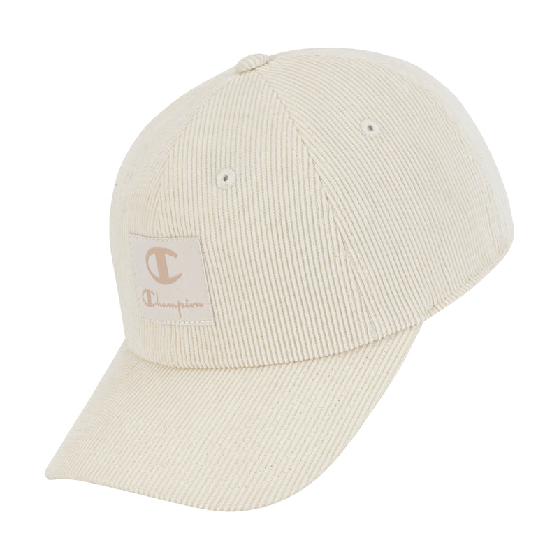 The Champion Ridge Corduroy Adjustable Cap features beige ribbed corduroy, a curved brim, a front square Champion logo patch, and an adjustable back closure for comfort.