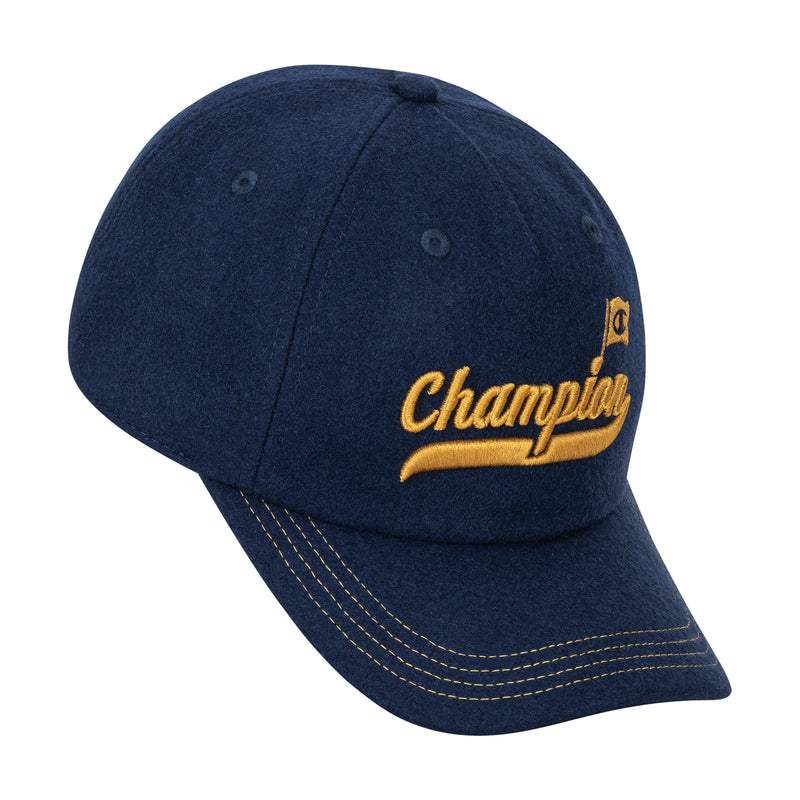 The Champion Sophomore Adjustable Cap is a dark blue, unconstructed collegiate-style cap with yellow stitching, Champion embroidered in yellow on the front, and a small yellow flag graphic.