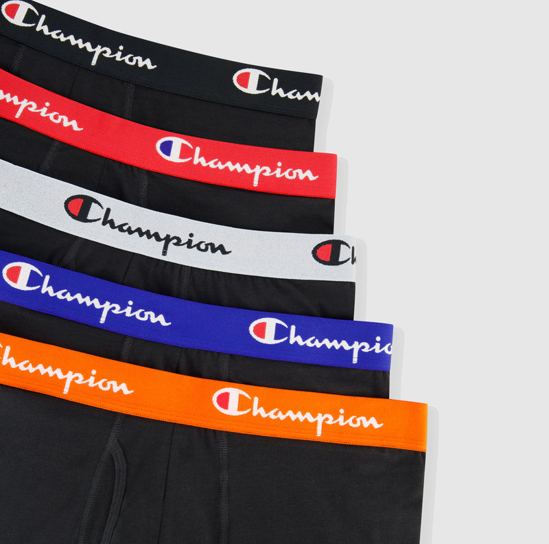 The Champion Cotton Stretch Boxer Brief 5-Pack features black briefs with multicolored waistbands—black, red, gray, blue, and orange—each displaying the white and red Champion logo.
