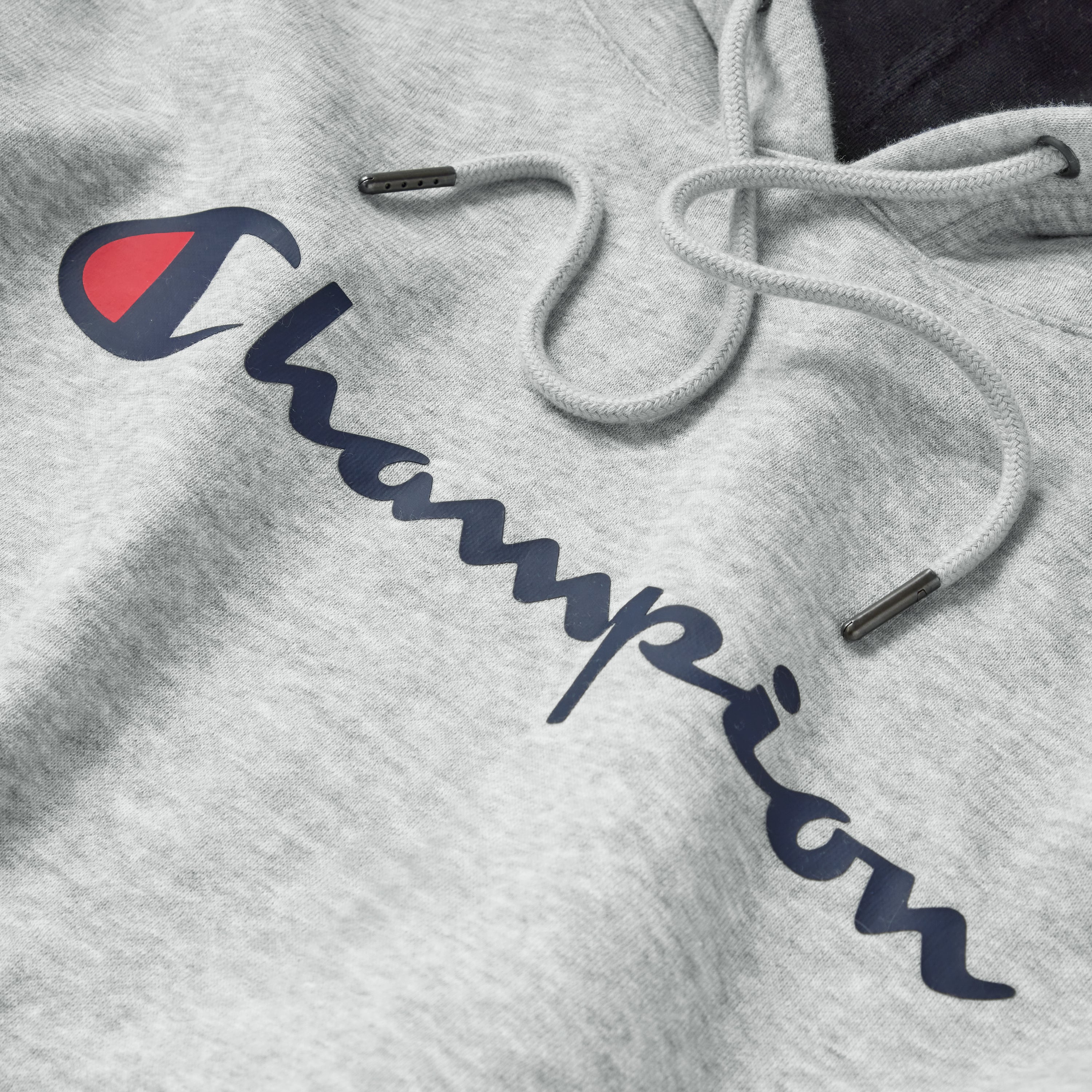 Gray hoodie with Champion logo on a plain background