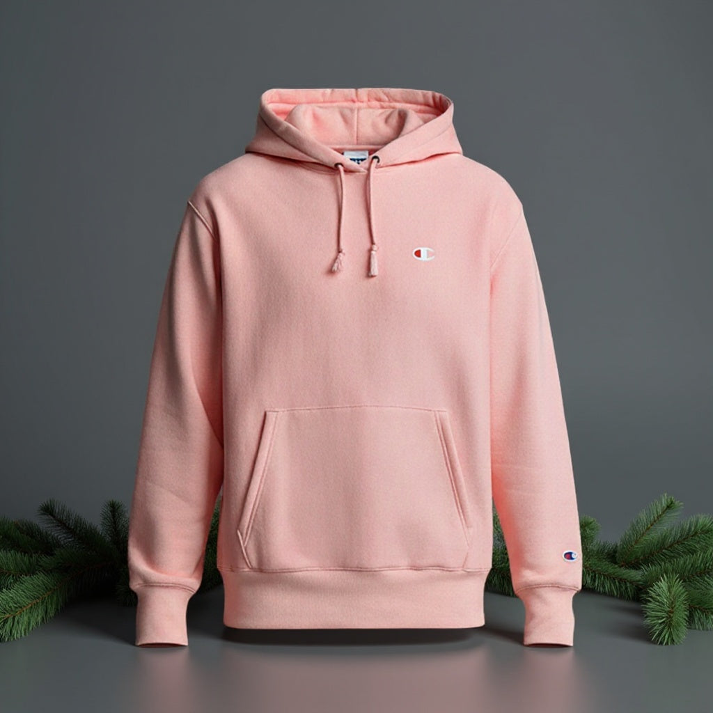 Pink hoodie with Champion logo on a dark gray background